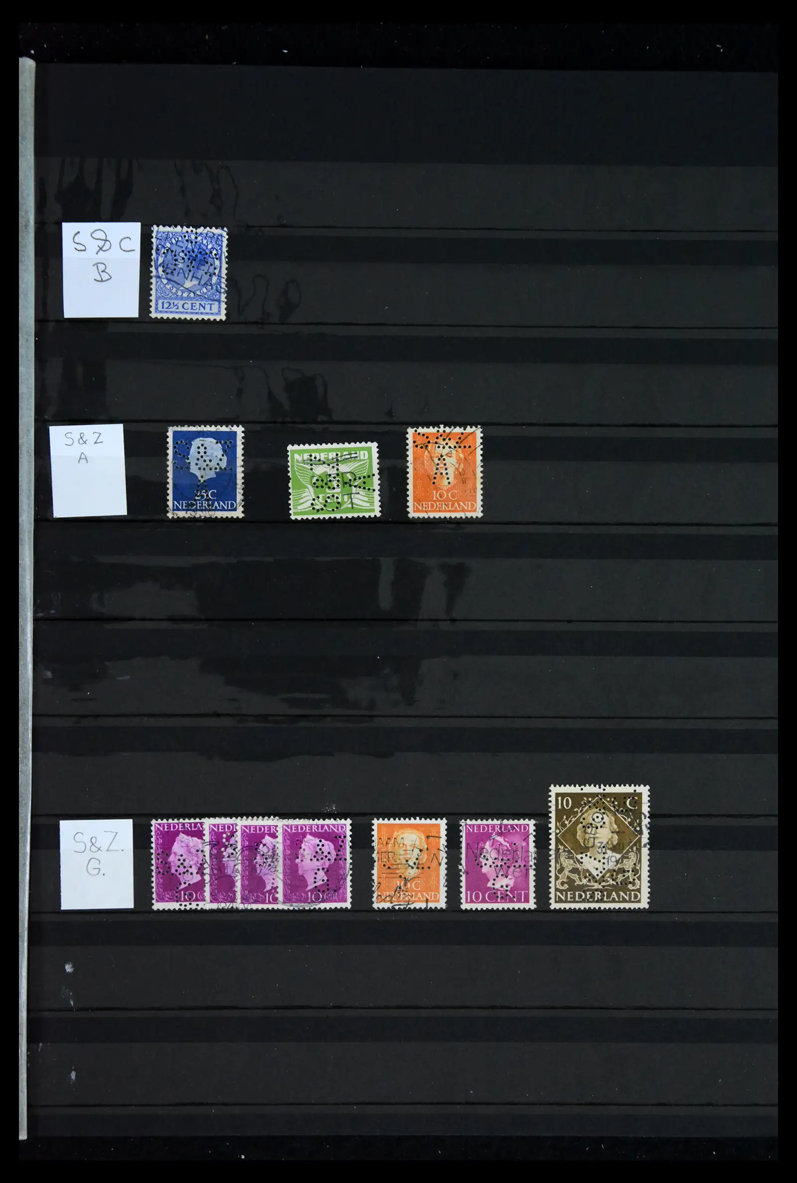 42202 0074 - Postzegelverzameling 42202 Nederland perfins 1891-1960.